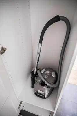 a computer mouse plugged into a wall with a hose at Vistula River Modern Apartment by BookingHost in Kraków