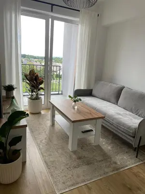 a living room with a couch and a coffee table at APARTAMENT AMZOHA in Zator