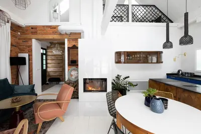 a living room with a couch and a fireplace at Chata Patykowo in Myślenice