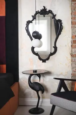 a table with a chair and a mirror at Chata Patykowo in Myślenice