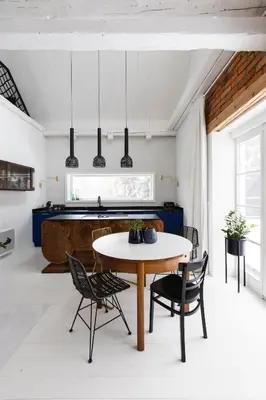 a kitchen and dining room with a table and chairs at Chata Patykowo in Myślenice