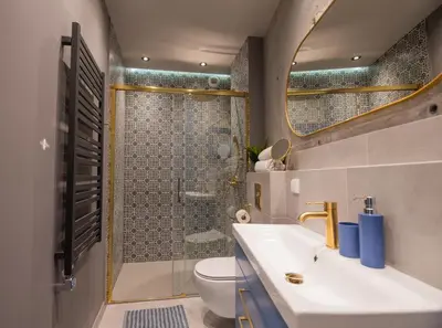 a bathroom with a sink and a shower at City Lights Mostowa 6 in Kraków