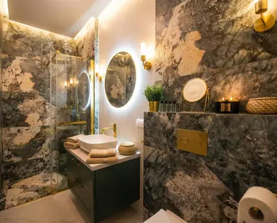 a bathroom with a sink and a shower at City Lights Mostowa 6 in Kraków