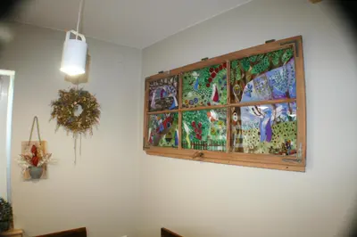 a painting hanging on a wall in a room at Apartamenty Siedlisko pod Aniołem in Zubrzyca Górna