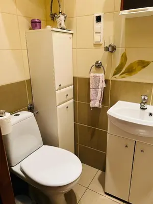 a small bathroom with a toilet and a sink at Retoryka in Kraków