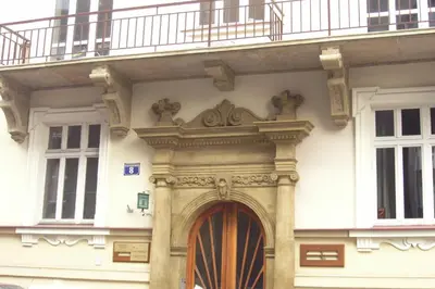a building with a wooden door and a balcony at Beauty of Krakow Studio in Kraków