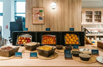 a table topped with lots of different types of fruit at MEININGER Kraków Centrum in Kraków