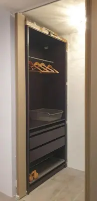 a walk in closet with shoes in it at Mini Apartament Kraków PN / Cracow NORTH z parkingiem in Kraków