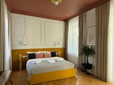 a bedroom with a large bed in a room at Premium apartment in Parisian style in the heart of Old Krakow in Kraków