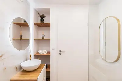 a bathroom with a sink and a mirror at Dom pod Lipą in Łyczanka