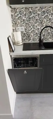 a kitchen with a sink and a stove at JUWEL Apartments Kraków Indyjski ap 29 in Kraków