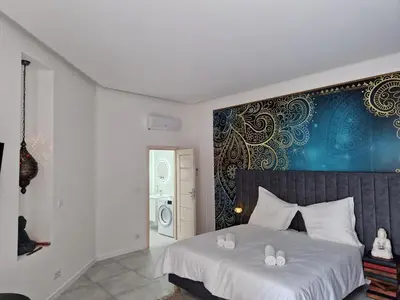 a bedroom with a bed with two towels on it at JUWEL Apartments Kraków Indyjski ap 29 in Kraków