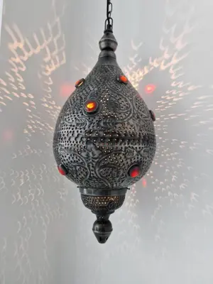 a christmas ornament hanging from a ceiling at JUWEL Apartments Kraków Indyjski ap 29 in Kraków