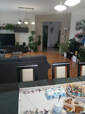 a living room with a table with food on it at Zielony Gaj in Gaj