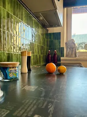 three oranges sitting on top of a counter in a room at Vintage Senacka 9/7 Apartment in Kraków
