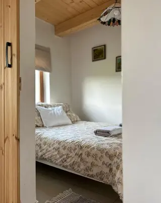 a bedroom with a bed in a room at Makowy domek in Maków Podhalański