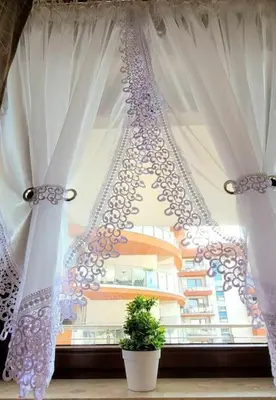 a window with white curtains and a potted plant at Modern Apartment SANDY BEACH down town, aquapark, free parking in Kraków