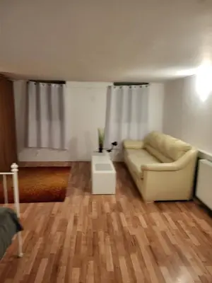 a living room with a couch and a table at Grzegorzecka Room nr 2 in Kraków