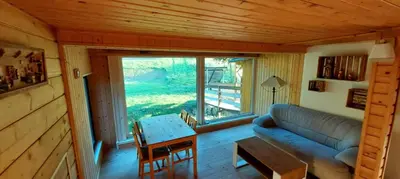 a living room with a couch and a table at 650m n.p.m. in Zawoja