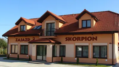 a building with a sign for a snowroom at Zajazd Skorpion B&B in Oświęcim