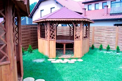 a gazebo in the yard of a house at Zajazd Skorpion B&B in Oświęcim
