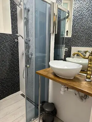 a bathroom with a sink and a shower at City Centre Apartment Wielopole in Kraków