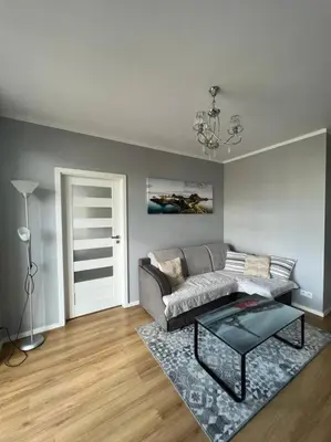 a living room with a couch and a table at Walenty Kraków in Kraków