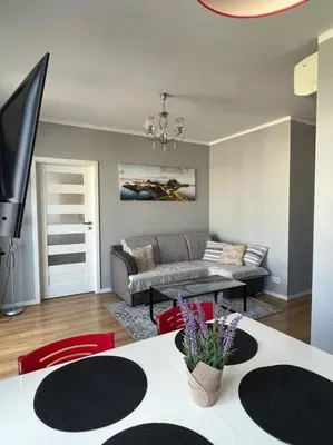 a living room with a couch and a table at Walenty Kraków in Kraków