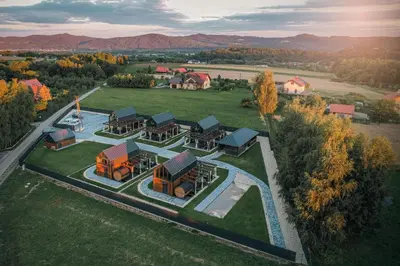 an aerial view of a building on a field at VILLAGE RESORT Sauna & Jacuzzi & Netflix in Tworkowa
