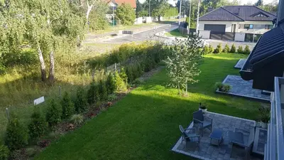 an aerial view of a yard with chairs and trees at Domek Zielone Marzenie in Chrzanów