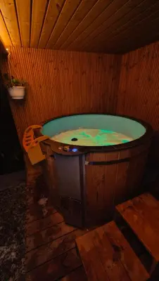 a large wooden bath tub in a room at Domek Zielone Marzenie in Chrzanów