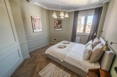 a bedroom with a bed and a window at Królewska Deluxe Comfy Apartment by BookingHost in Kraków