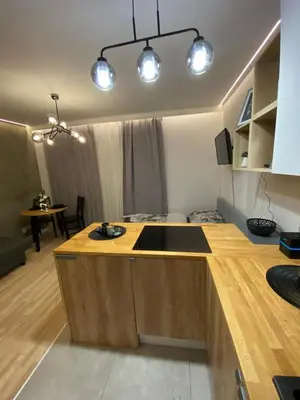 a kitchen with a counter with a sink in it at Love Glow Studio in Kraków
