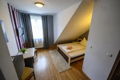 a small room with a bed and a window at Hotel Restauracja Sara in Laskowa