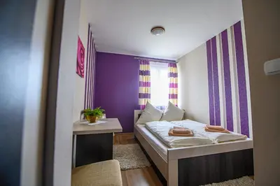 a small bedroom with a bed and a window at Hotel Restauracja Sara in Laskowa