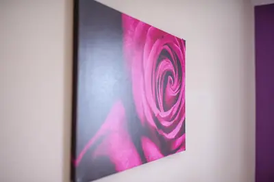 a picture of a pink painting on a wall at Hotel Restauracja Sara in Laskowa