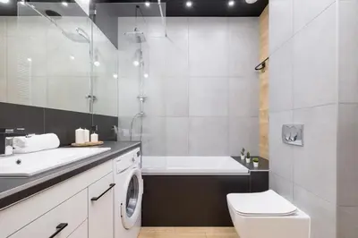 a bathroom with a sink and a toilet and a tub at Kraków Studio with Parking & Terrace near Zalew Bagry by Renters Prestige in Kraków