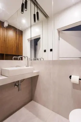 a bathroom with a sink and a mirror at City of the Kings-Julia Apartment in Kraków