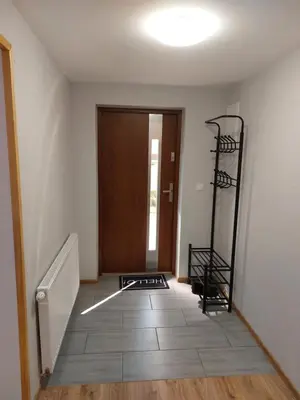 an empty room with a staircase and a door at Agroturystyka ,Jarzębina' in Harkabuz