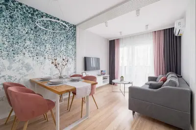 a living room with a table and a couch at Vetulaniego Apartment with Air Conditioning & Parking by Renters Prestige in Kraków
