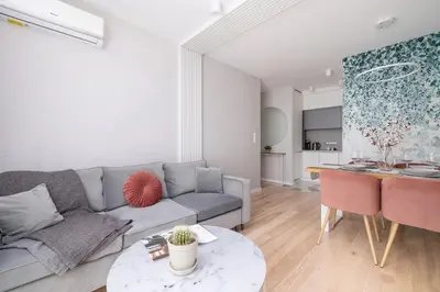a living room with a couch and a table at Vetulaniego Apartment with Air Conditioning & Parking by Renters Prestige in Kraków