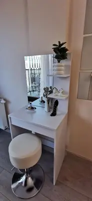 a white desk with a chair and a mirror at COMFORT Apartment Pawia street - free parking !!! in Kraków