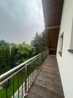 a balcony of a building with a view of trees at Noclegi Wilga in Gromiec