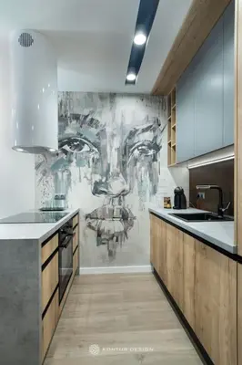 a kitchen with a painting on the wall at City of the Kings-Szmaragd in Kraków