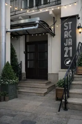 a front door of a building with stairs and lights at Urban Nest Apartments Szewska 21-R in Kraków