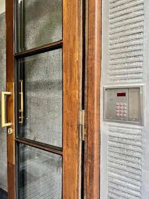 a door with a control panel next to a window at Krakow Old Town Apartment Jacuzzi - wymeldowanie do 13 in Kraków
