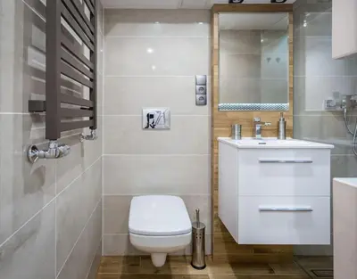 a bathroom with a toilet and a sink and a mirror at Cozy Stay Apartment - Kazimierz in Kraków