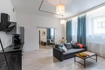 a living room with a couch and a table at Apartment Quiet Street 11, 3E in Oświęcim