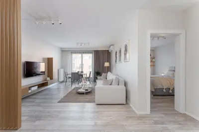a living room with a couch and a bed at Modern Apartments with FREE parking spots in Kraków