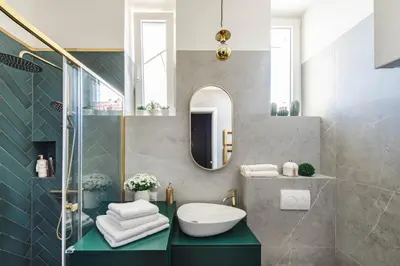 a bathroom with a sink and a mirror at Copernicus House in Kraków